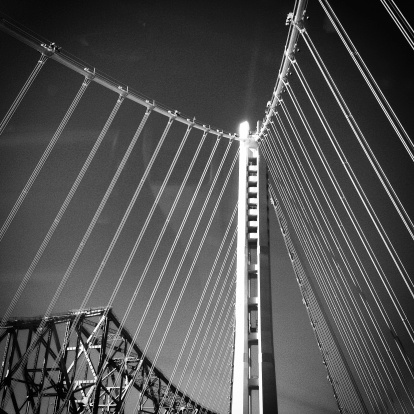 A black and white shot of the new Bay Bridge, against the old, decommissioned one.  Taken with an iPhone and processed in Instagram.