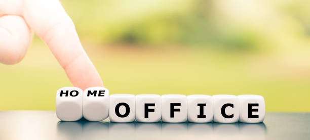 Be in home office during the corona crisis. Hand turns dice and changes the expression "office" to "home office". Be in home office during the corona crisis. Hand turns dice and changes the expression "office" to "home office". dice photos stock pictures, royalty-free photos & images