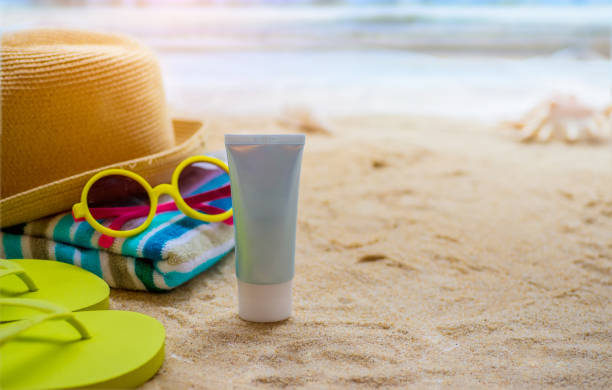 beach accessories on table on beach - summer holidays - beach towel imagens e fotografias de stock