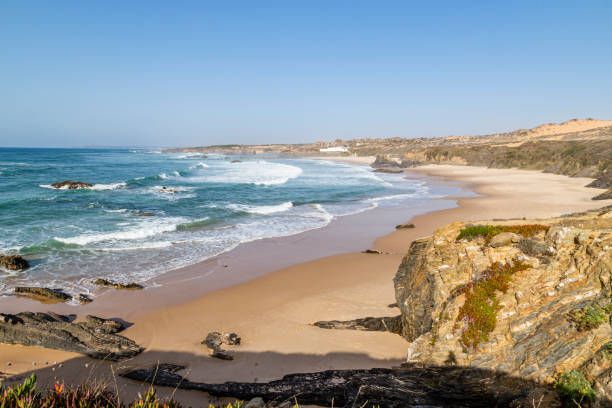 beach and bay Praia do Almograve, Alentejo, Portugal stock photo