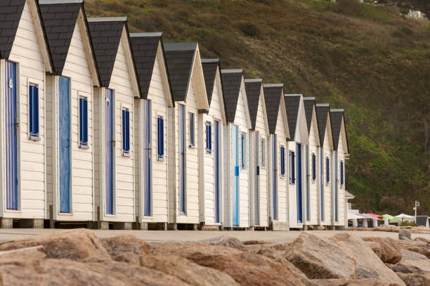 Beach cabins in Barneville-Carteret Normandy Australia Beach cabins in Barneville-Carteret Normandy France in summer barneville carteret stock pictures, royalty-free photos & images
