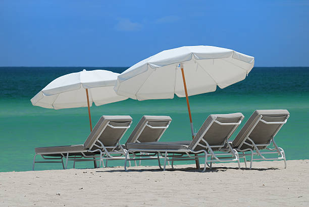 Beach chairs and umbrellas stock photo