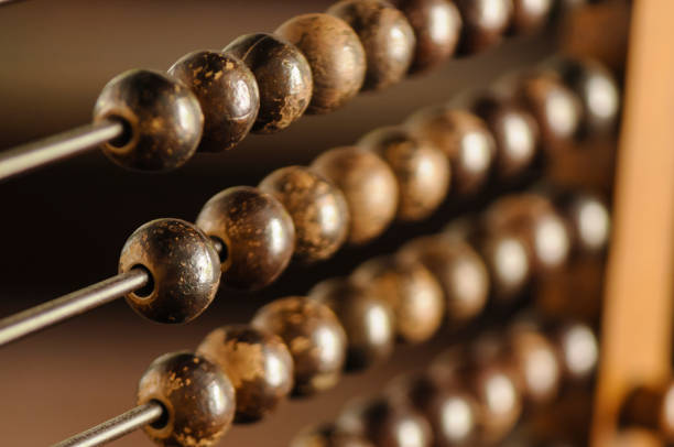 Beads on an abacus Beads on an abacus abacus stock pictures, royalty-free photos & images