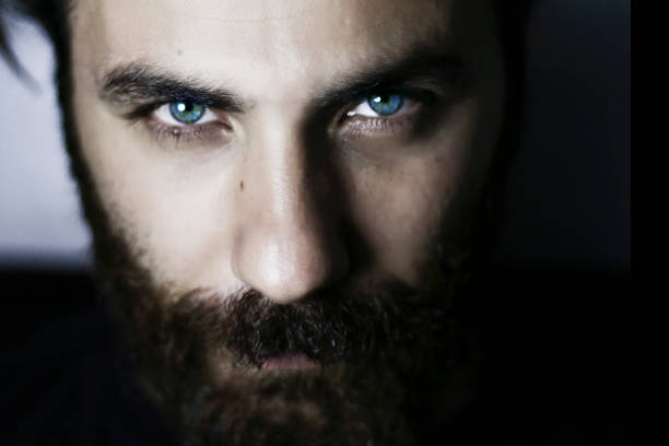 Bearded man portrait close-up blue eyes stock photo