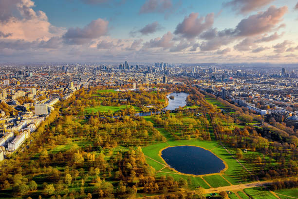 Beautiful aerial panoramic view of the Hyde park in London Beautiful aerial view of the Hyde park in London, UK. Magical sunset view over the park with London skyline on the horizon. central london stock pictures, royalty-free photos & images