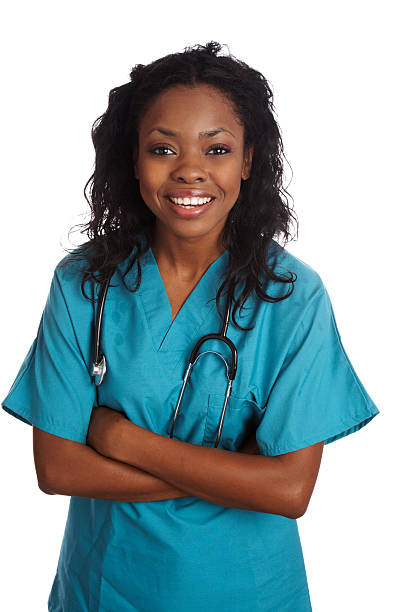 Beautiful african american nurse smiling with crossed arms stock photo