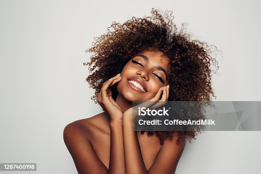 istock Beautiful afro woman with perfect make-up 1287400198