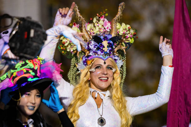 Beautiful and scary costumes dresses at NYC Village Halloween parade stock photo