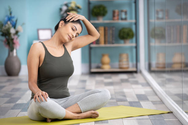 Beautiful attractive young woman doing yoga exercising at home, Health concept, Fitness concept, stock photo stock photo