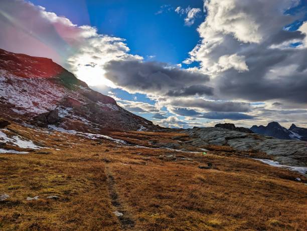 Photo of beautiful autumn hike in the beautiful swiss mountains Panorama picture with the first snow.Mountain peaks full of snow