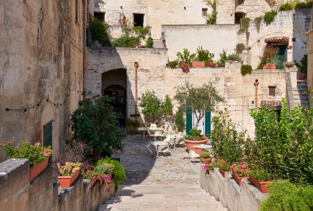 Beautiful backyards decorated with trees and flowers at old town of matera stock photo