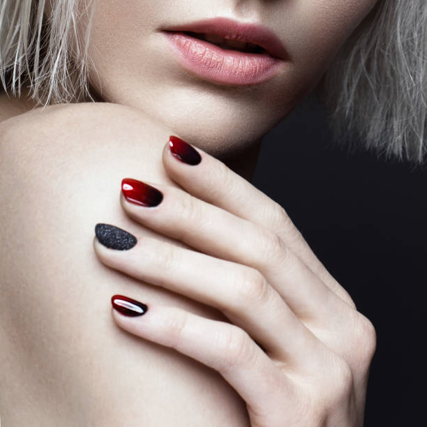 Beautiful blond girl with dark smokey makeup and art manicure design nails. beauty face. Beautiful blond girl with dark smokey makeup and art manicure design nails. beauty face. Photos shot in studio gel nail polish stock pictures, royalty-free photos & images