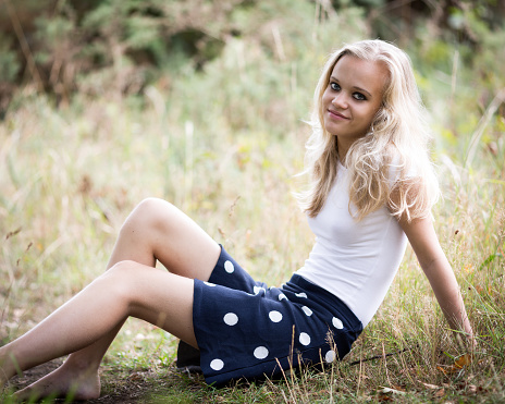 Beautiful Blond Teenage Girl Outside In The Woods Stock 
