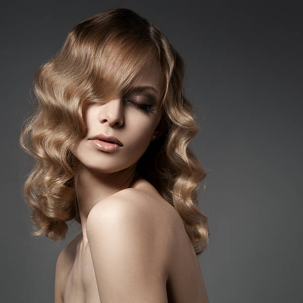 Beautiful Blond Woman. Curly Long Hair stock photo