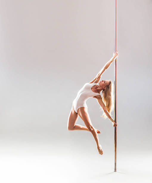 Beautiful blonde sexy pole dance woman stock photo