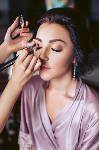 A Beautiful Bride Makeup Artist Applies Makeup Wedding Morning Of The Bride  Stock Photo - Download Image Now - iStock