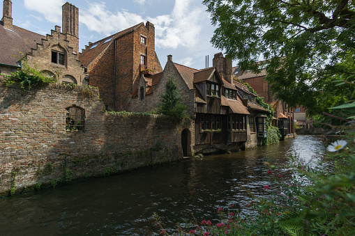 Beautiful canal and traditional houses near Bonifazius Bridge in the old town of Bruges, Belgium