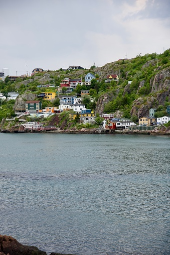 Newfoundland and Labrador, Canada - July 6, 2019: View of beautiful colorful houses built on the rocky slope of the Signal Hill in St. John's Newfoundland
