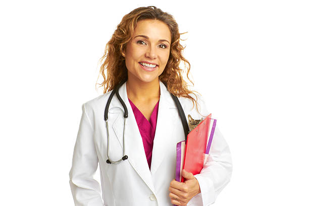 Beautiful confident female doctor holding clipboard smiling stock photo