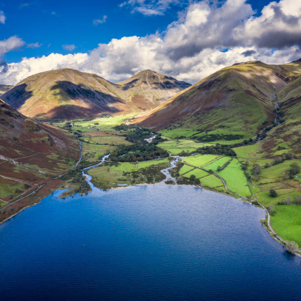 Beautiful drone view over Lake District landscape in late Summer, in Wast Water valley with mountain views and dramatic sky Stunning high point of view from flying drone over Lake District landscape in late Summer, in Wast Water valley with mountain views english lake district stock pictures, royalty-free photos & images
