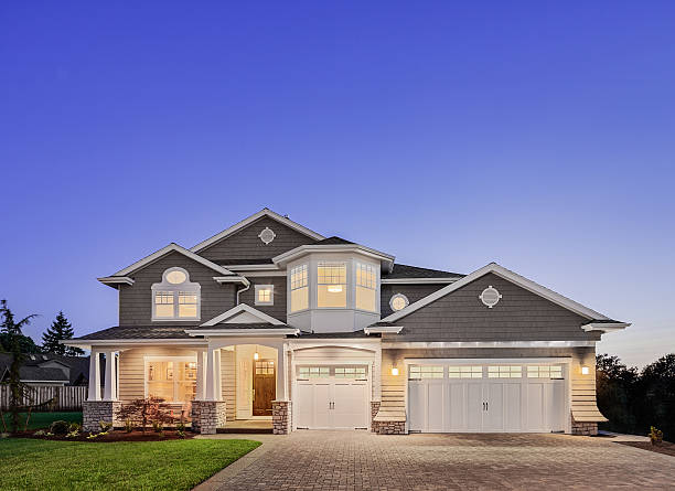 Beautiful Exterior of New Luxury Home at Twilight stock photo