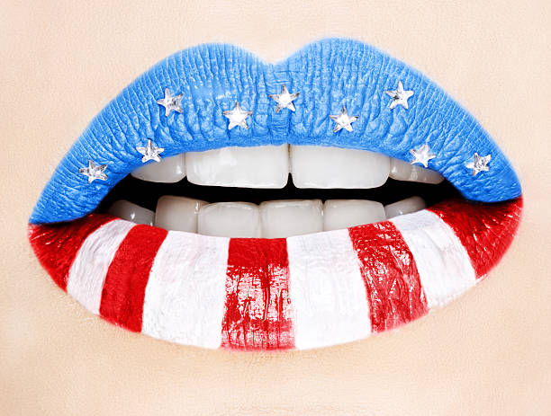 Beautiful female lips painted with American flag stock photo