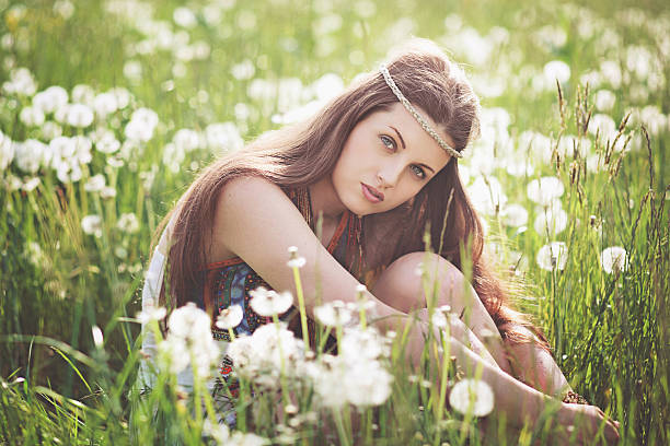 Beautiful free girl in a flower meadow stock photo