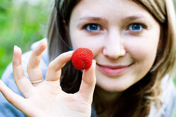 Beautiful girl with red berry stock photo
