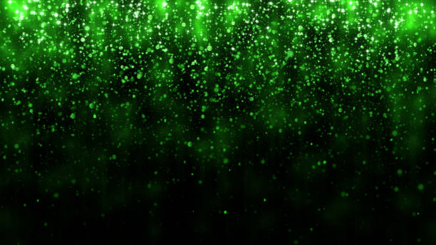Beautiful glitter light background. Background with green falling particles template for premium design. Falling bright confetti and magic light stock photo