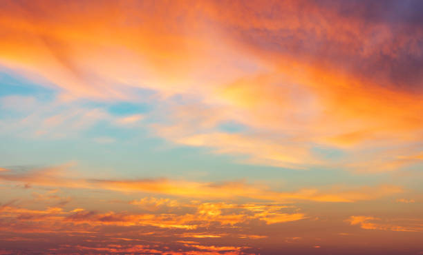 beautiful glowing pink and golden cirrus clouds after storm at sunset, colorful dramatic sunset cloudscape, soft sunlight - céu fenómeno natural imagens e fotografias de stock