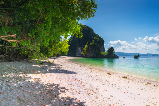 Beautiful green lagoon and white sand beach surrounded by limestone rocks at Koh Hong island at Krabi province, Thailand.