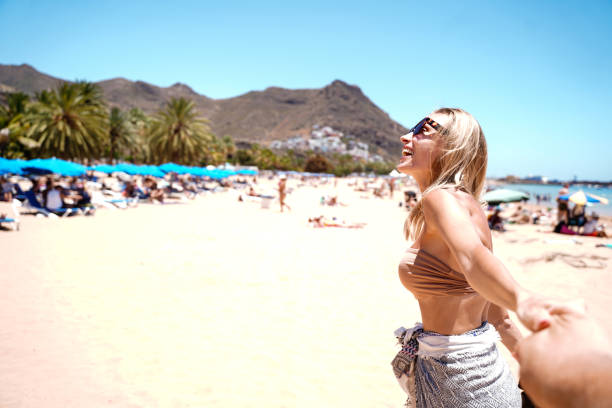 beautiful happy woman enjoying sunny vacation day on the beach. island summer vibes. - cargo canarias imagens e fotografias de stock