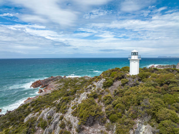 Beautiful high angle aerial drone view of Rocky Cape Lighthouse, part of Rocky Cape National Park, located on the North-West Coast of the island of Tasmania, Australia. stock photo