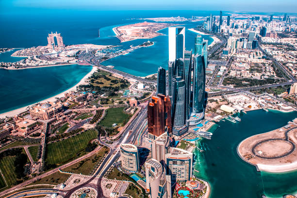 Beautiful high angle view of modern skyscrapers in Abu Dhabi, taken from a helicopter. Marina is also visible further back stock photo