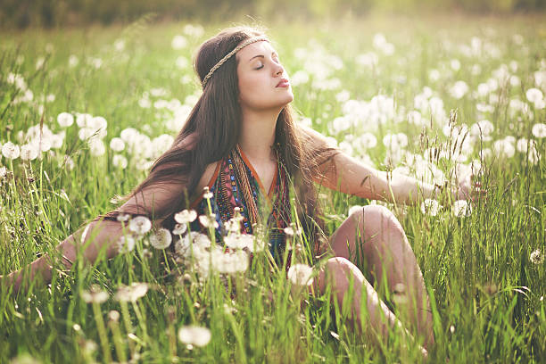Beautiful hippie woman enjoying sun stock photo