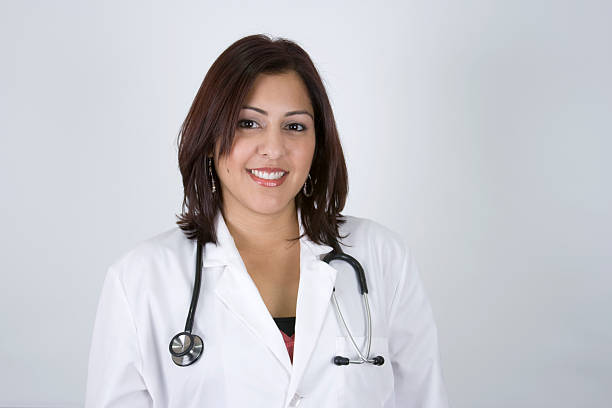 Beautiful Hispanic Woman Doctor on White Background Beautiful Hispanic Woman Doctor on White Background puerto rican women stock pictures, royalty-free photos & images