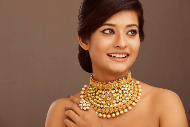 Beautiful Indian young women portrait with jewelry Pretty Indian young women portrait with jewelry in studio shot. indian jewelry stock pictures, royalty-free photos & images
