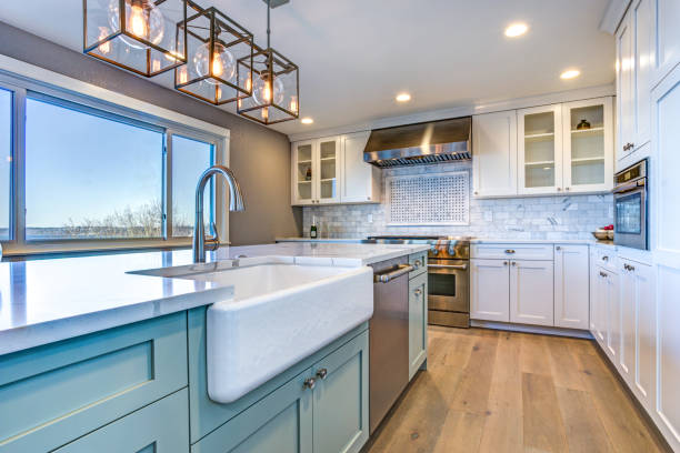 beautiful kitchen room with green island and farm sink. - kitchen imagens e fotografias de stock