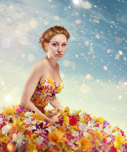 Beautiful lady in dress of flowers stock photo