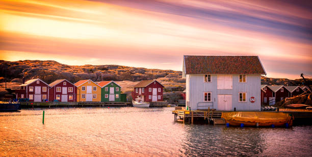 Beautiful landscape view of sunset and houses at Smogen Idyllic village of Smogen in Bohuslan, Sweden. fishing village stock pictures, royalty-free photos & images