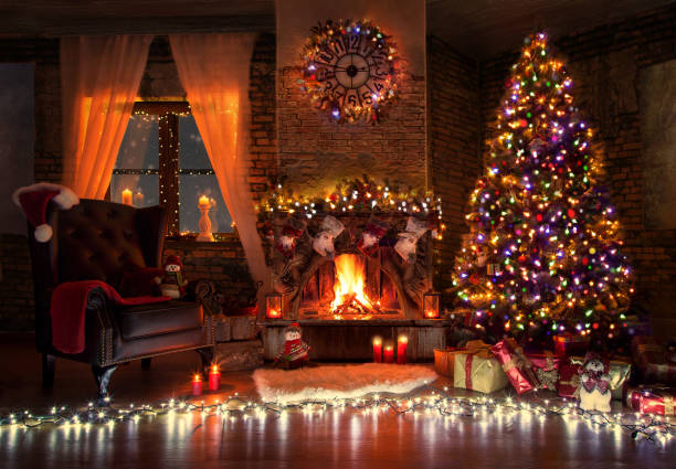Beautiful living room with fire place decorated for christmas stock photo