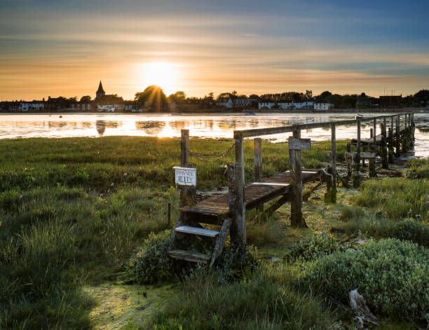 Beautiful Low tide landscape of Bosham Harbour with private jetty. stock photo