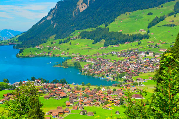 Beautiful Lungernsee and village lungern in the Alps, Switzerland Beautiful lake in the Alps, Switzerland lungern village switzerland lake stock pictures, royalty-free photos & images