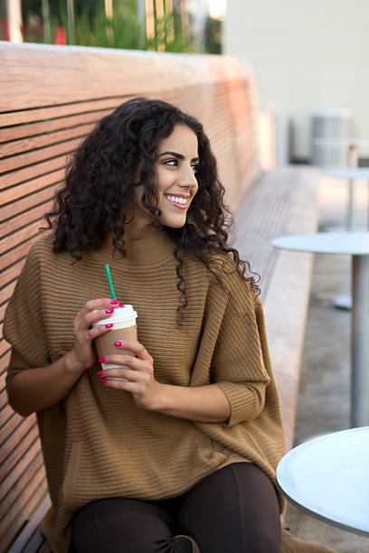 Beautiful Middle Eastern woman drinks coffee Beautiful Middle Eastern woman drinks coffee. hot middle eastern girls stock pictures, royalty-free photos & images