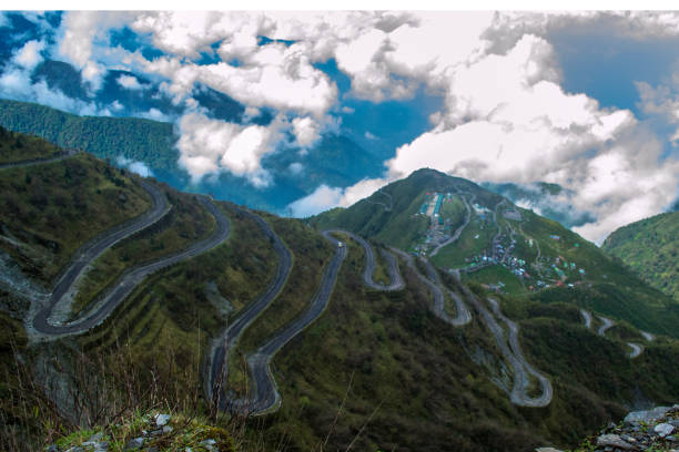 A beautiful mountain road A beautiful mountain road with ninety two bends at Silk Route Sikkim silk road stock pictures, royalty-free photos & images