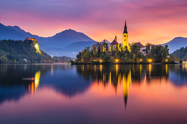 beautiful, multicolored sunrise over an alpine lake Bled in Slovenia beautiful, multicolored sunrise over an alpine lake Bled in Slovenia slovenia stock pictures, royalty-free photos & images