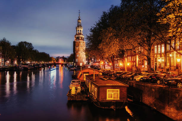 Beautiful night in Amsterdam. Night illumination of buildings and...