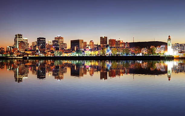 Beautiful Old Montreal with Water Reflection at Sunset  buzbuzzer montreal city stock pictures, royalty-free photos & images
