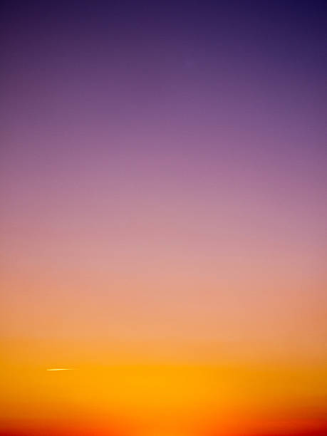 Photo of beautiful orange to purple gradient evening sky