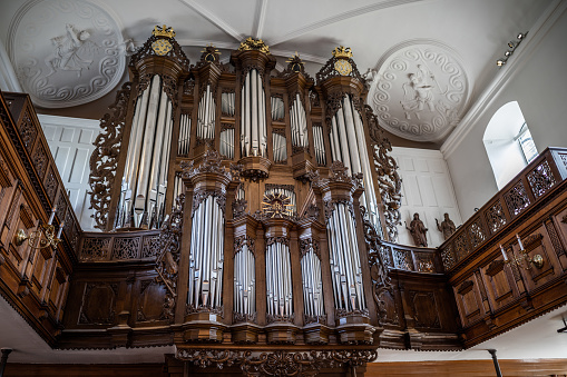 Beautiful pipe organ in Holmen's Church, Copenhagen, Denmark.\nHolmen's Church in central Copenhagen, Denmark, is parish church for the districts around Christiansborg, the Danish parliament, as well as for people of the sea. It was built in 1538 as anchor smithy, but in 1619 king Christian IV converted it into the church we know today.